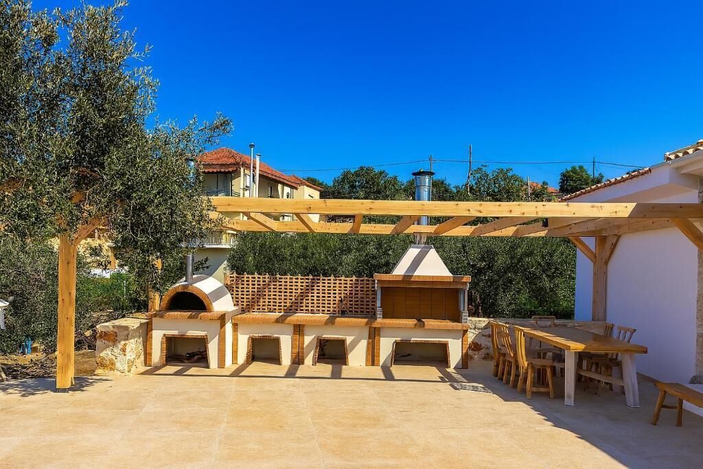 Villa de lujo, vista al mar | Restaurante al aire libre