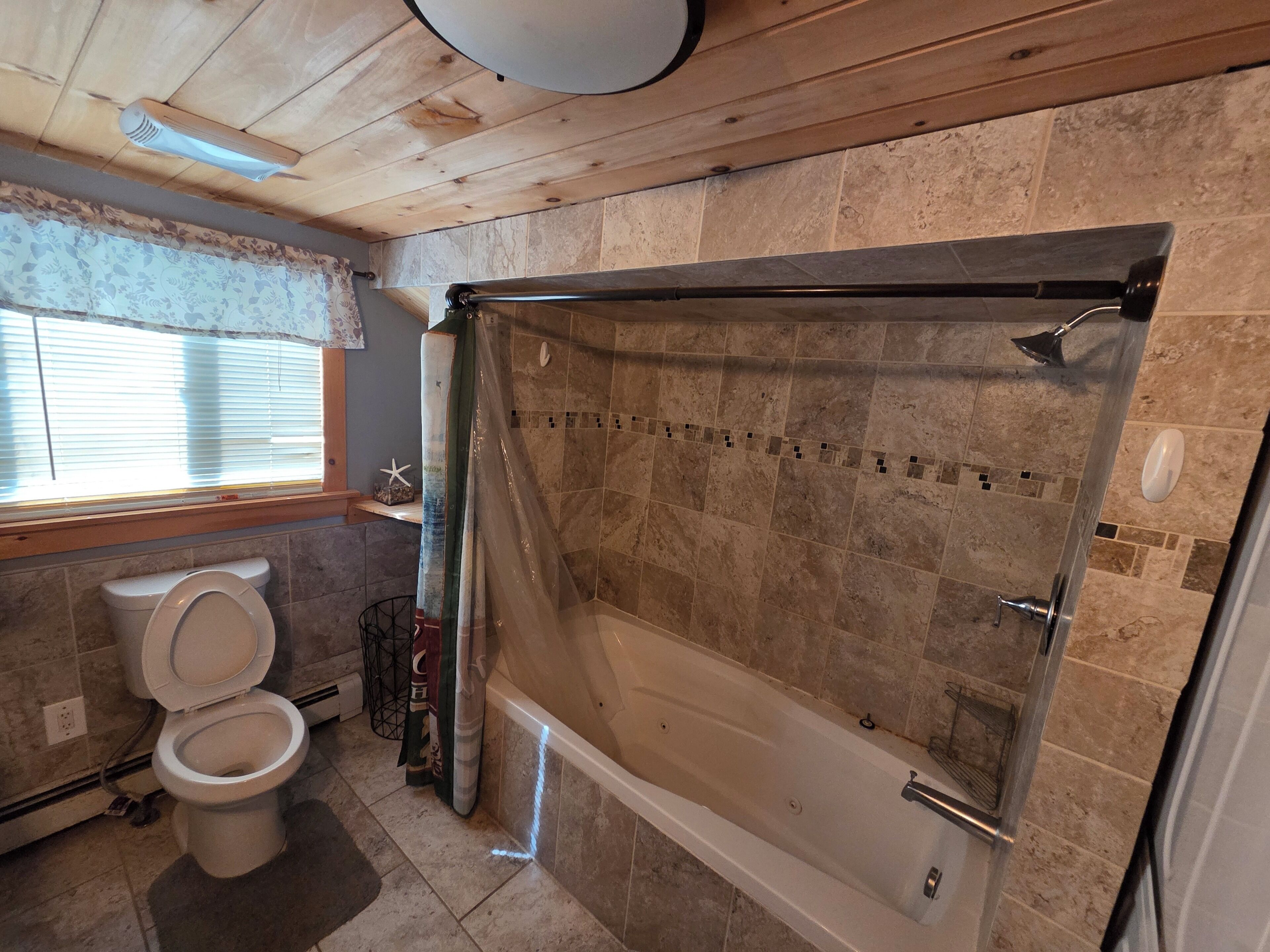 Jetted bath, towels, soap, toilet paper