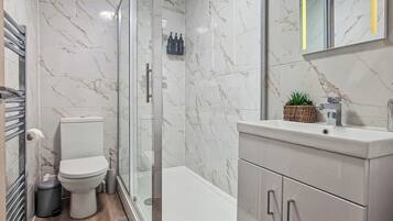 Shower, hair dryer, towels, soap