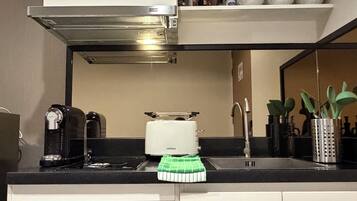 Fridge, microwave, stovetop, coffee/tea maker