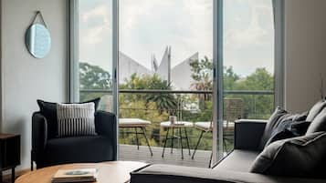 Deluxe Apartment, Balcony | Living area