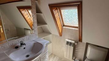 Bidet, towels, soap, toilet paper