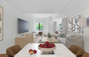 A modern living room with a flat-screen TV, a dining table with apples, a sofa, and abstract wall art.