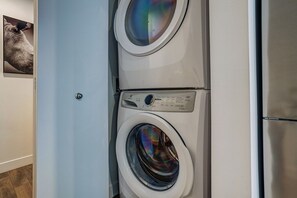A front view of a modern, two-door laundry room with a control panel on the door. - Montreal - C Lofts Le Smith 2 Bedroom (Montreal)