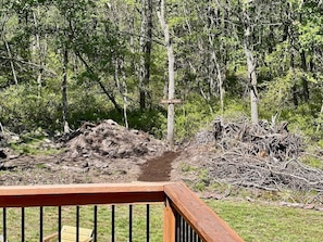 A hiking trail with a wooden railing in the foreground.
