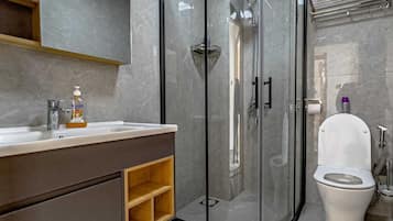 Shower, free toiletries, slippers, towels