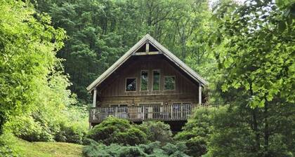 Whispering Waters Chalet: Mountain Loft Living with Hot Tub & Games