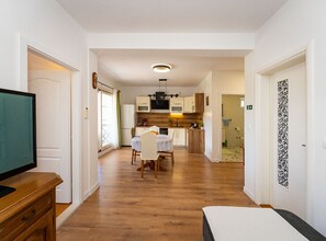 A compact apartment with a kitchenette, a dining area, and a living room. - Comfort Two Bedroom Apartment (Pero) (Ploce)