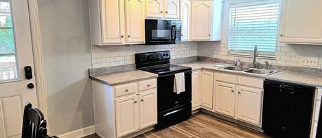 Coffee/tea maker, fridge, microwave, oven