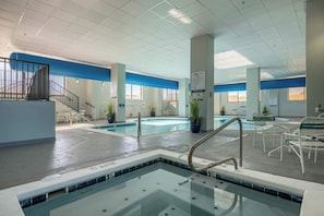 A pool area with a diving board, lounge chairs, and a sign indicating no diving. - Oceanfront Retreat | Pool | Deck | 2 Balconies (Ocean City)