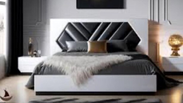 Une chambre moderne avec un lit, des tables de chevet et une œuvre d’art accrochée au mur.