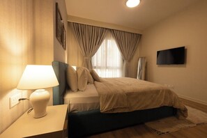 Desk, laptop workspace, iron/ironing board, free WiFi - Peravi Suites at Harmonia Residence  (Accra)