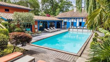 Seasonal outdoor pool, open 10:00 AM to 7:00 PM, sun loungers