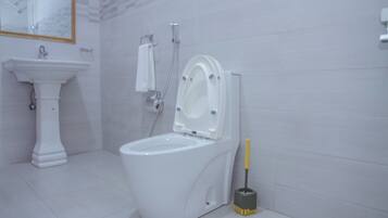 Deluxe Double Room, Balcony, City View | Raised toilet seat