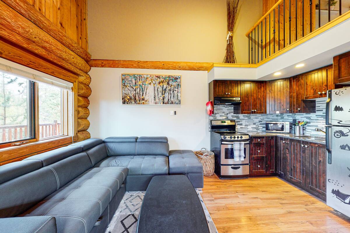 A modern kitchen with wooden cabinets, a built-in oven, and a refrigerator.