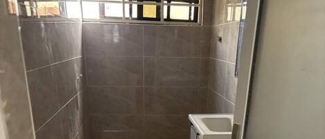 Shower, towels, soap, toilet paper