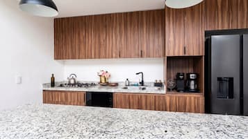 Luxury Apartment | Private kitchen | Stovetop, eco-friendly cleaning products, paper towels, kitchen islands