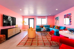A modern living room with a sofa, chairs, a coffee table, and a television. - $400k Backyard-Luxe Stay- Epicenter of Old Town! (Scottsdale)