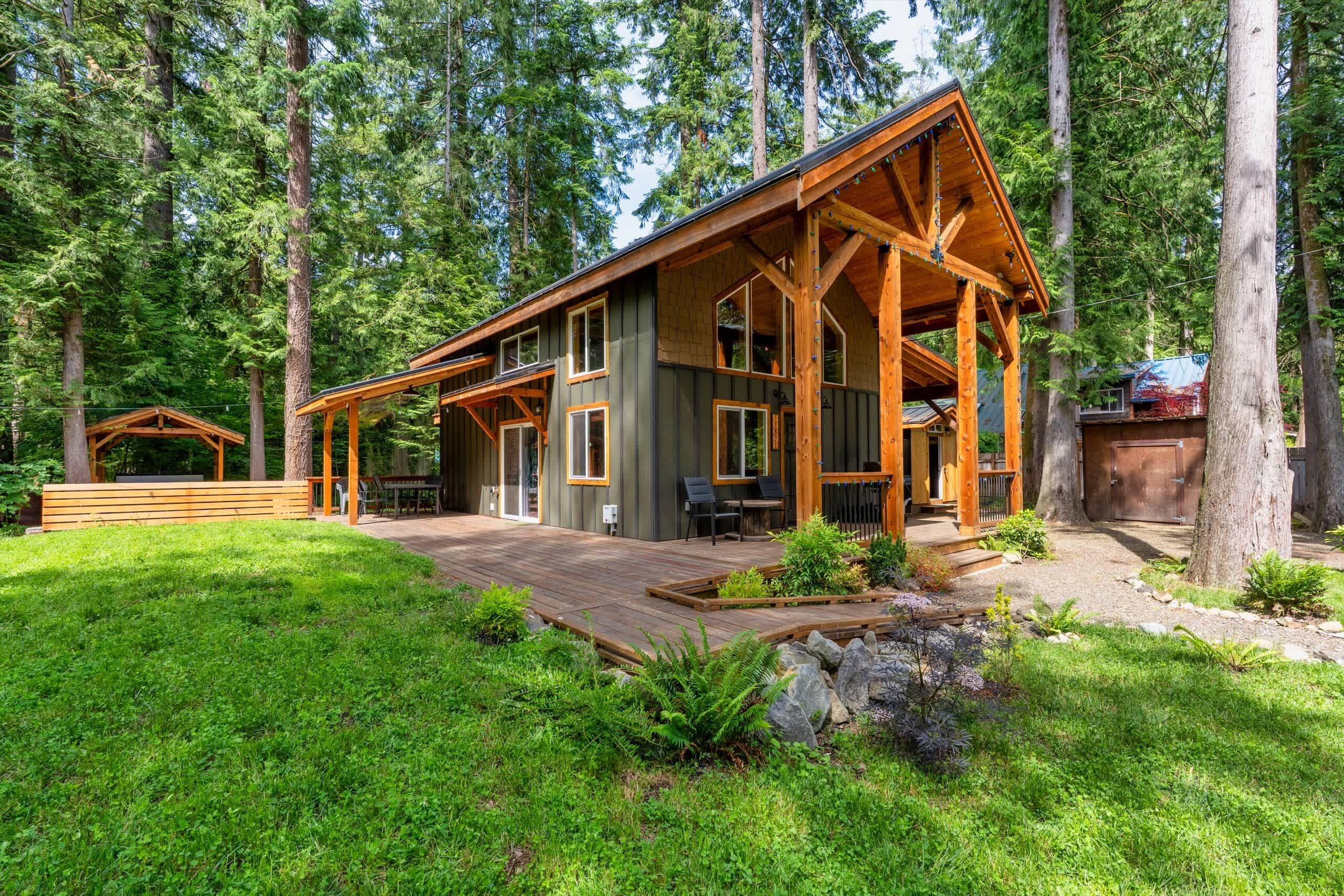 Cabin exterior tucked among the trees.