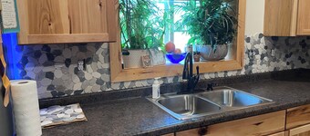 Charming 2-bedroom shouse seated on 50 acres in tranquil Long Prairie with AC.