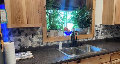 Charming 2-bedroom shouse seated on 50 acres in tranquil Long Prairie with AC.