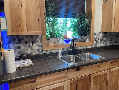 Charming 2-bedroom shouse seated on 50 acres in tranquil Long Prairie with AC.