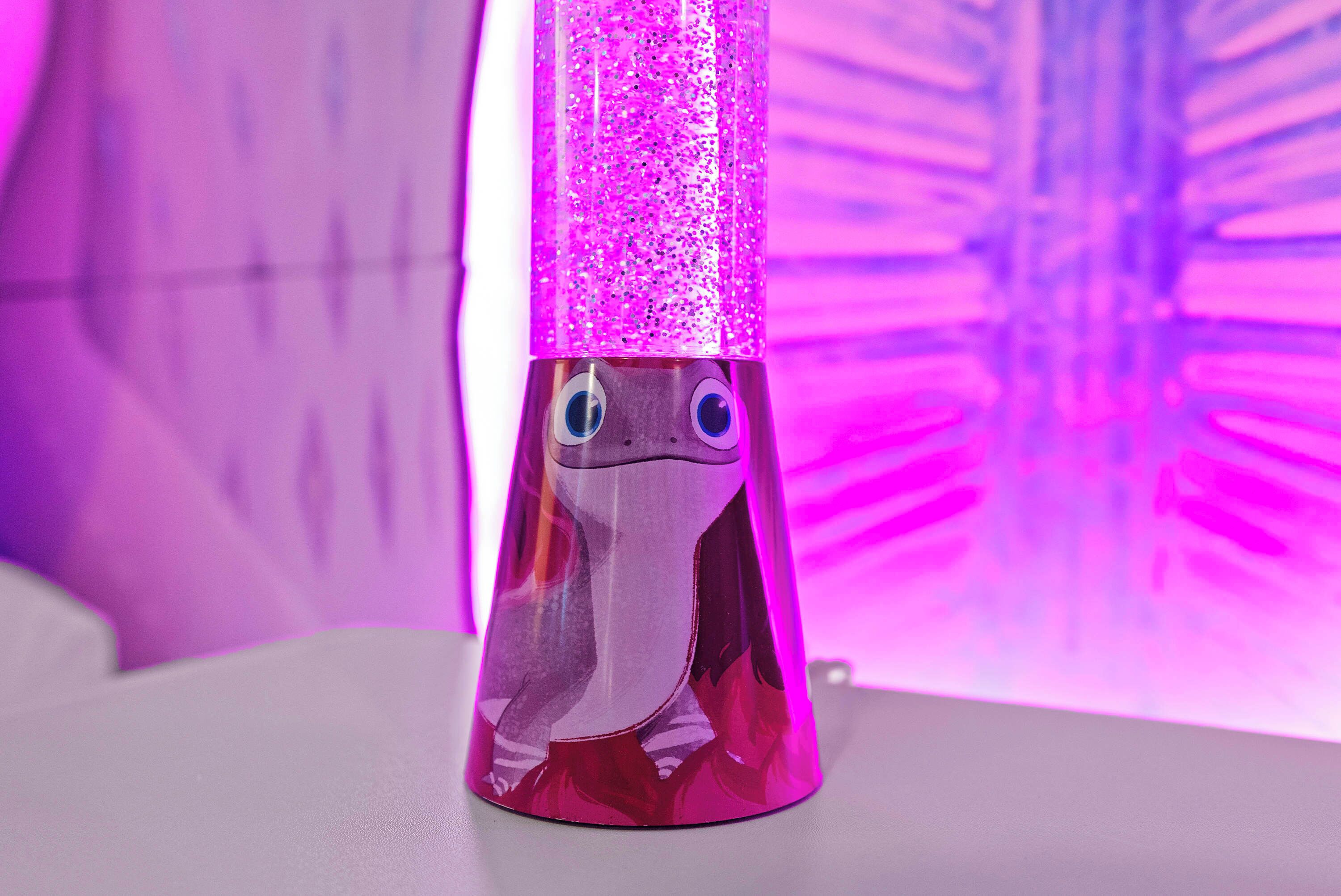 A pink, glittery object with a face, possibly a toy or decoration, on a white surface.