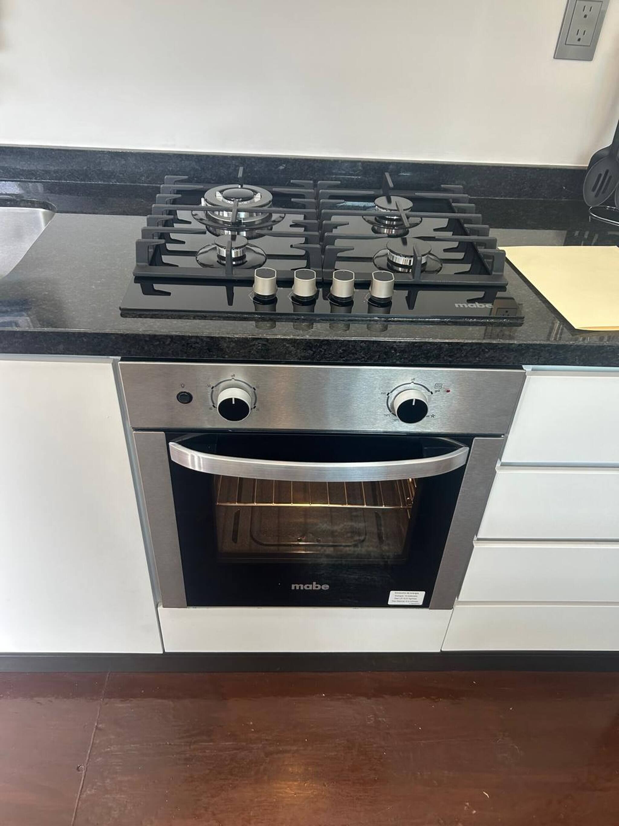 A kitchen with a stove, oven, and a countertop.