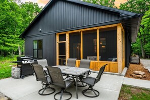 Outdoor dining - Private home on 1.5 wooded acres in Door County conveniently located in Ephraim. (Sister Bay)