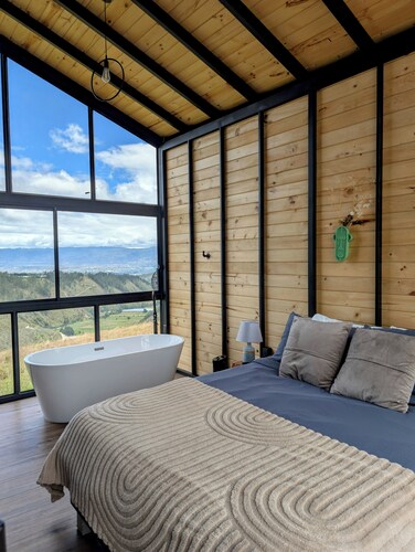 Serene luxury cabin in front of Cotopaxi volcano for a relaxing getaway