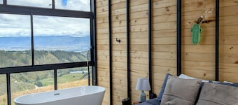 Serene luxury cabin in front of Cotopaxi volcano for a relaxing getaway