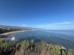 A coastal landscape with a beach, ocean, and distant mountains. - New! Casa Capricho in West Beach with A/C, private yard, walk to beach (Santa Barbara)