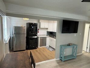 A modern kitchen with a built-in oven, a refrigerator, and a dishwasher. - Sunset-bay condo #3!   2BR/1 BA-1st floor-Dogs OK! (Brigantine)
