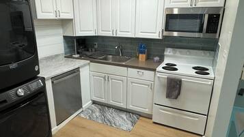 Fridge, microwave, stovetop, coffee/tea maker