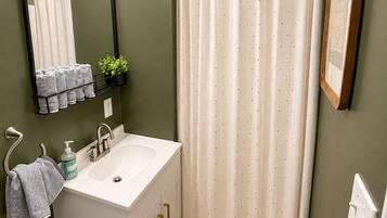 Shower, towels, soap, toilet paper
