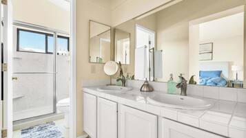 Spacious Primary Ensuite
Freshen up in the bright primary ensuite featuring a double-sink vanity, plenty of counter space, and direct access to the walk-in shower.
