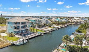 A waterfront property with multiple buildings, docks, and a marina.