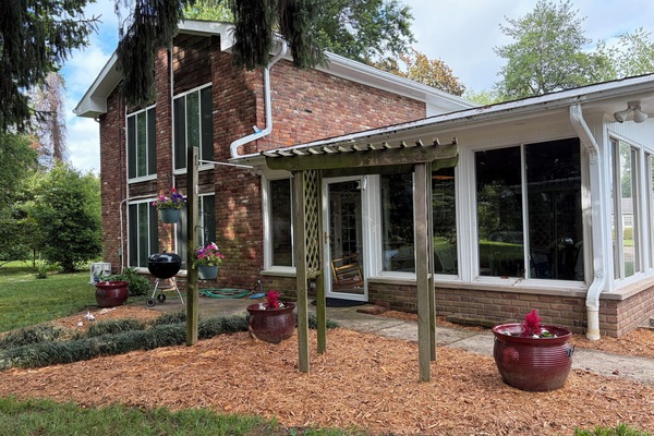 The back door is accessible with no steps into the Sunroom. Enjoy the grill!