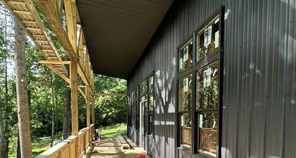 Brand new creekside home with hot tub, private dock and boat ramp!
