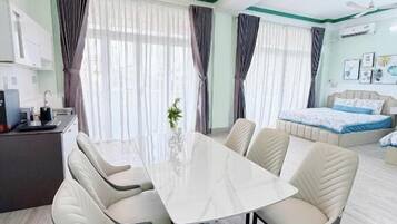 Family Room, Balcony, City View | Dining