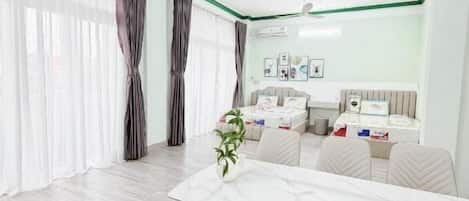 Family Room, Balcony, City View | Free WiFi