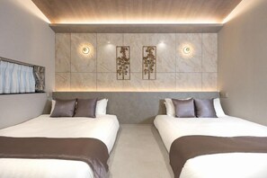 A hotel room with two beds, a marble wall, and wall-mounted lighting. - JAPAVISTA Luminous (SHIMANOUCHI, CHUO WARD)
