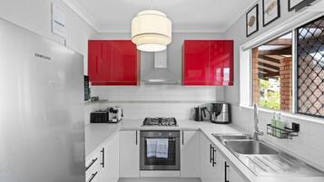 Coffee/tea maker, fridge, microwave, oven