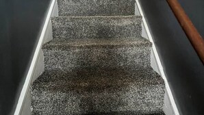 A staircase with carpeted steps leading to a landing with a light fixture. - The Buck Lodge | Arcade • Firepit (Wheeling)