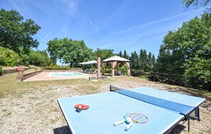 An outdoor recreational area with a ping pong table, a small pool, and a gazebo. - Pet friendly home in Allerona (Allerona)