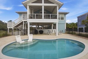 A two-story house with a swimming pool, a covered patio, and a fenced deck. - New St George Island Retreat  Pool Pet Friendly (Saint George Island)