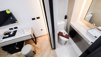 Shower, hair dryer, slippers, towels