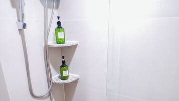 Shower, hair dryer, slippers, towels