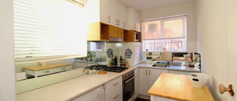 Microwave, stovetop, dishwasher, coffee/tea maker