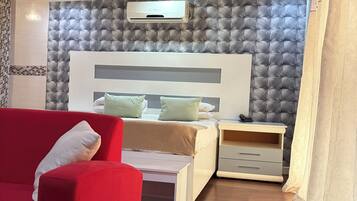 Deluxe Triple Room, Patio, Garden View